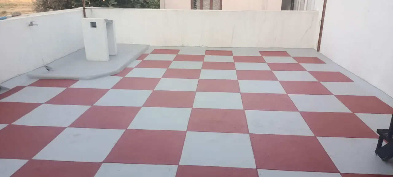 Terrace roof coated in a red and white checkerboard pattern